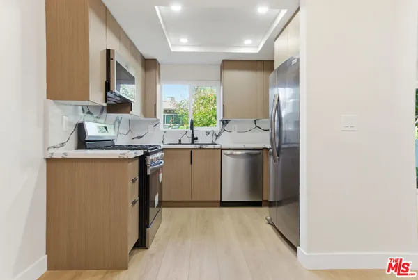 a kitchen with a stove and a microwave