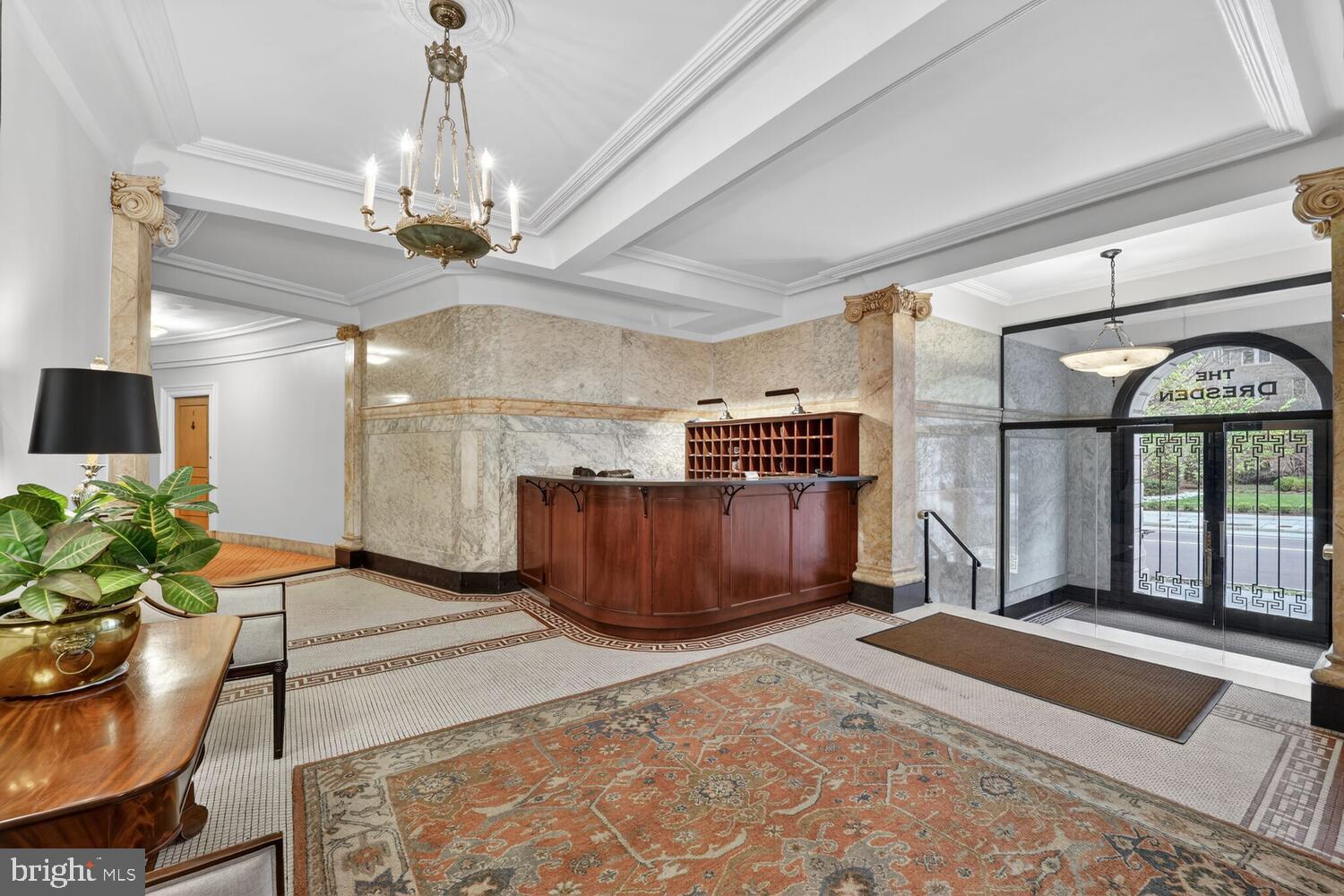 2126 Connecticut Avenue Northwest, Unit 17 Washington, DC 20008 - Photo 26 of 36 a room with furniture and a chandelier