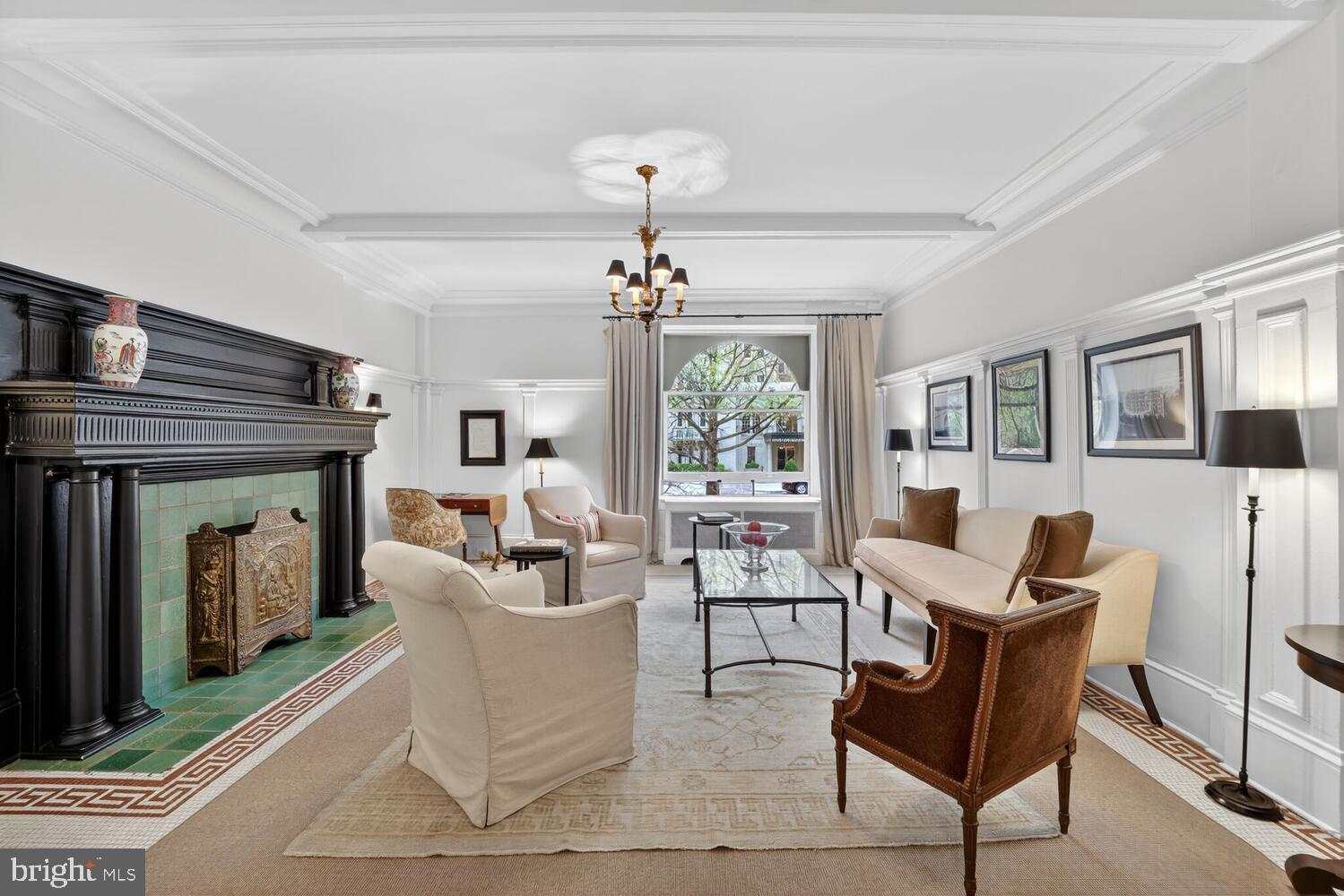 2126 Connecticut Avenue Northwest, Unit 17 Washington, DC 20008 - Photo 28 of 36 a living room with furniture a fireplace and a chandelier