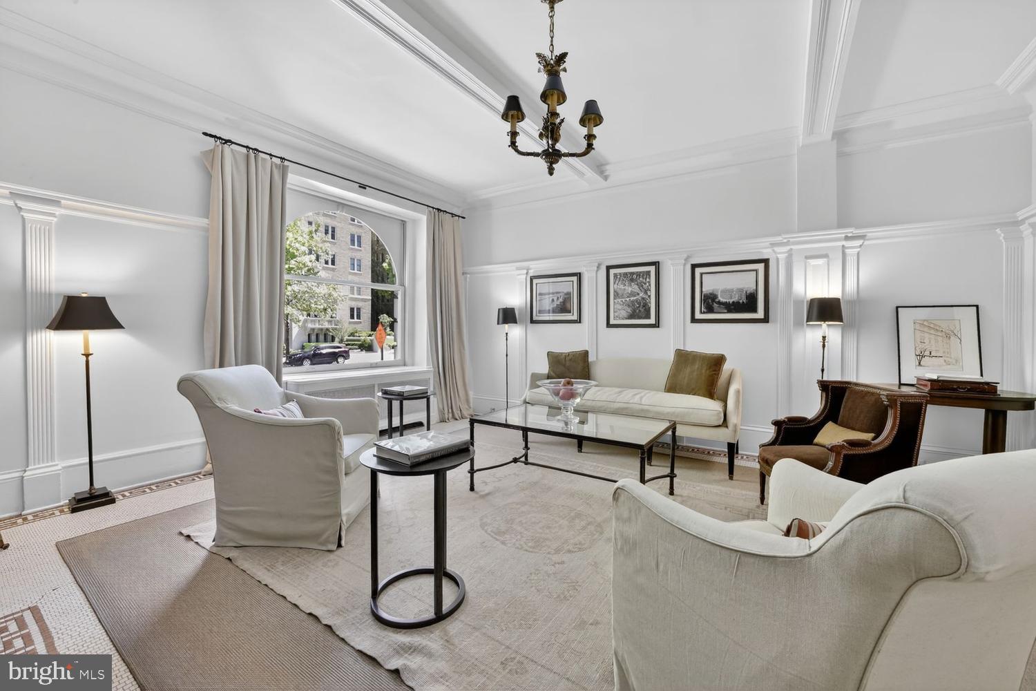 2126 Connecticut Avenue Northwest, Unit 17 Washington, DC 20008 - Photo 29 of 36 a living room with furniture a chandelier and a window