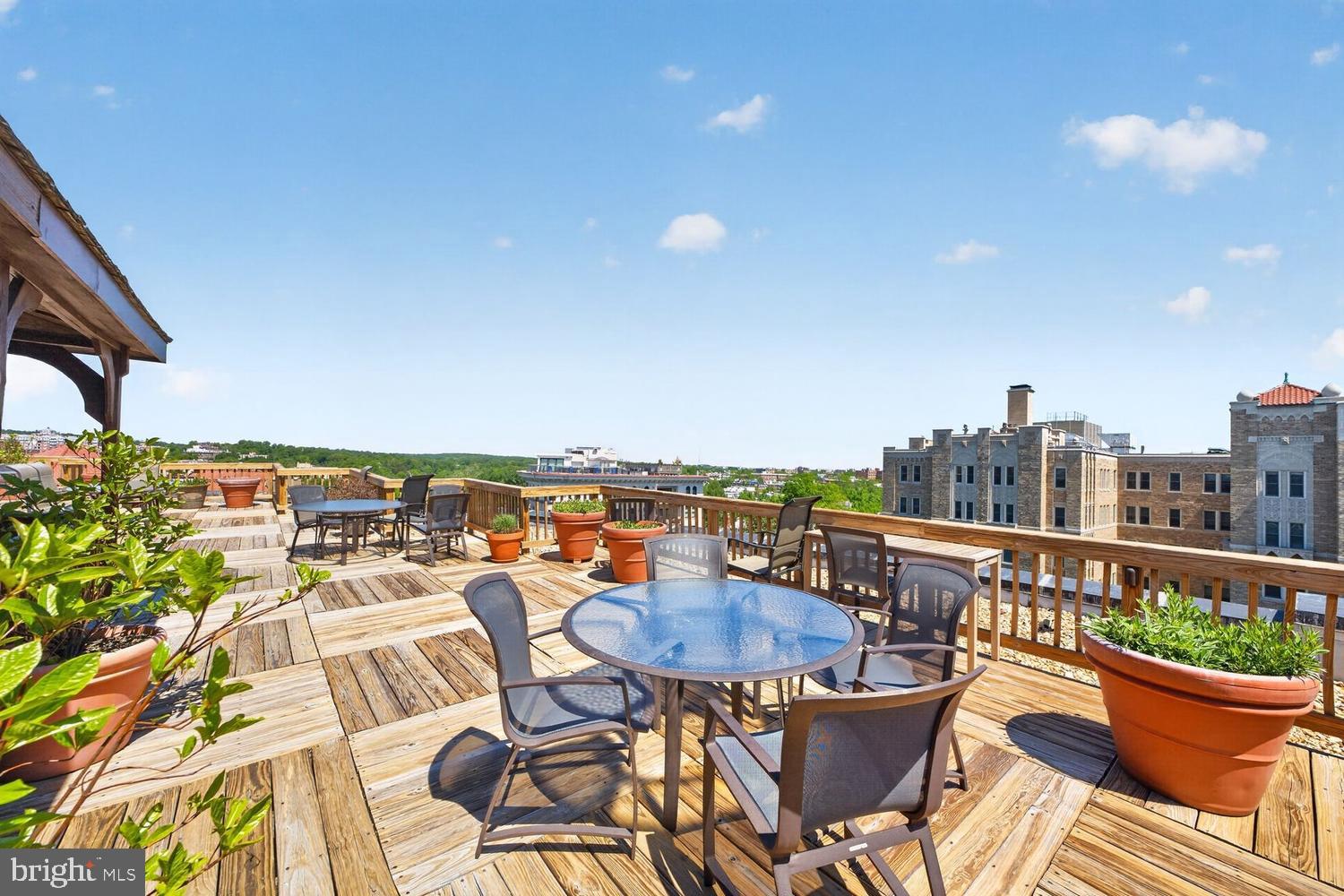 2126 Connecticut Avenue Northwest, Unit 17 Washington, DC 20008 - Photo 32 of 36 a view of a roof deck with furniture and a terrace