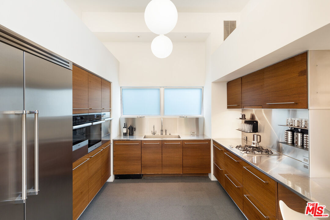 7800 West 81st Street Playa del Rey, CA 90293 - Photo 11 of 27 a kitchen with stainless steel appliances granite countertop a sink a stove and a refrigerator