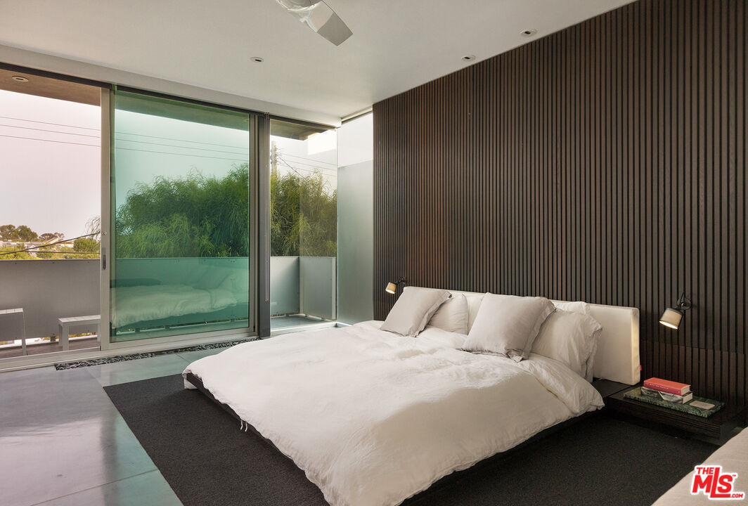 7800 West 81st Street Playa del Rey, CA 90293 - Photo 19 of 27 a bedroom with a large bed and a balcony view