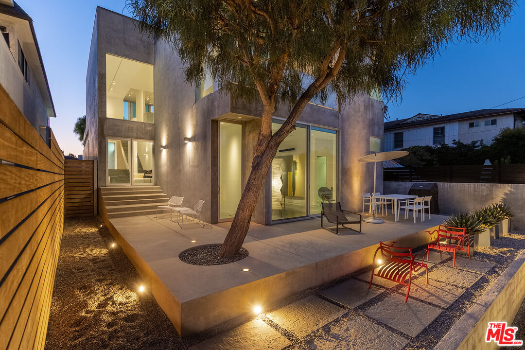 7800 West 81st Street Playa del Rey, CA 90293 - Photo 2 of 27 a view of a house with backyard water fountain and sitting area