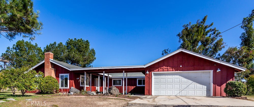 15735 Pennington Place Riverside, CA 92504 - Photo 1 of 1 a front view of a house with garden