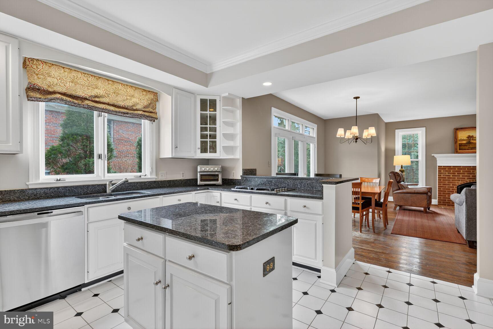5206 Little Falls Road Arlington, VA 22207 - Photo 11 of 49 a kitchen with sink stove and dining table