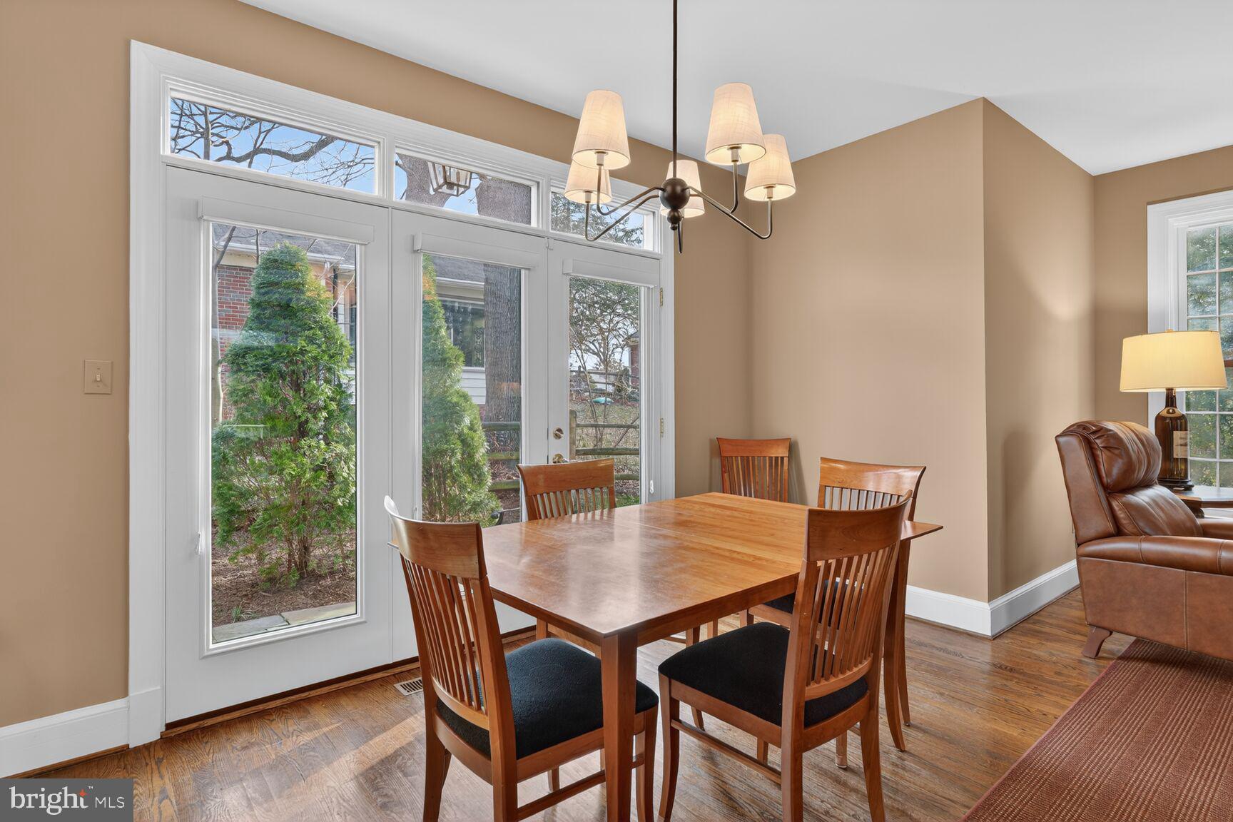 5206 Little Falls Road Arlington, VA 22207 - Photo 15 of 49 a view of a dining room with furniture wooden floor and chandelier