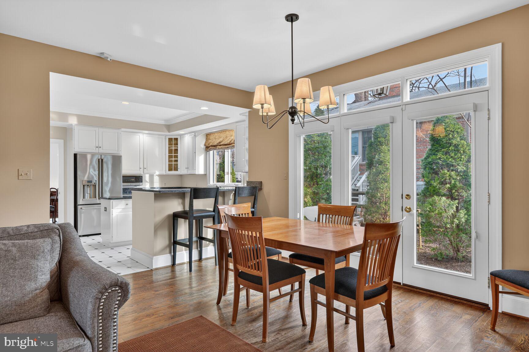 5206 Little Falls Road Arlington, VA 22207 - Photo 16 of 49 a view of a dining room with furniture window and wooden floor