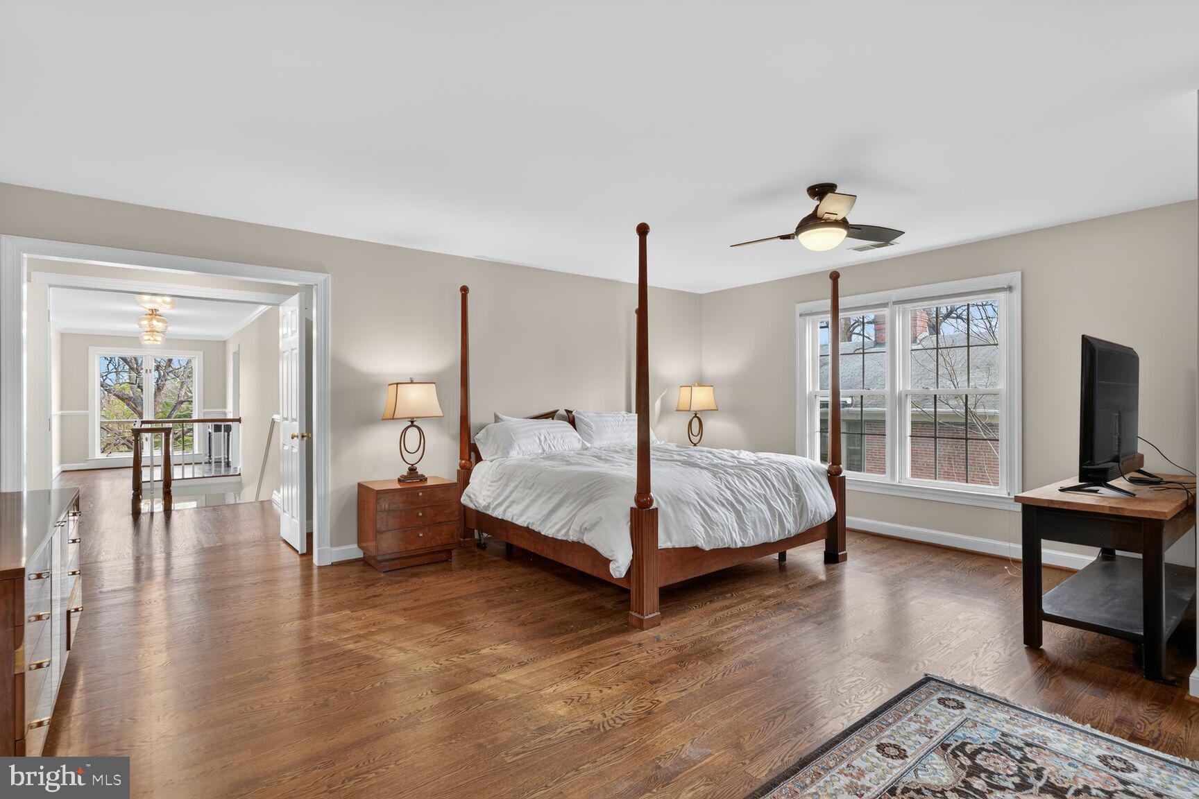 5206 Little Falls Road Arlington, VA 22207 - Photo 27 of 49 a bedroom with a bed a large window and flat screen tv