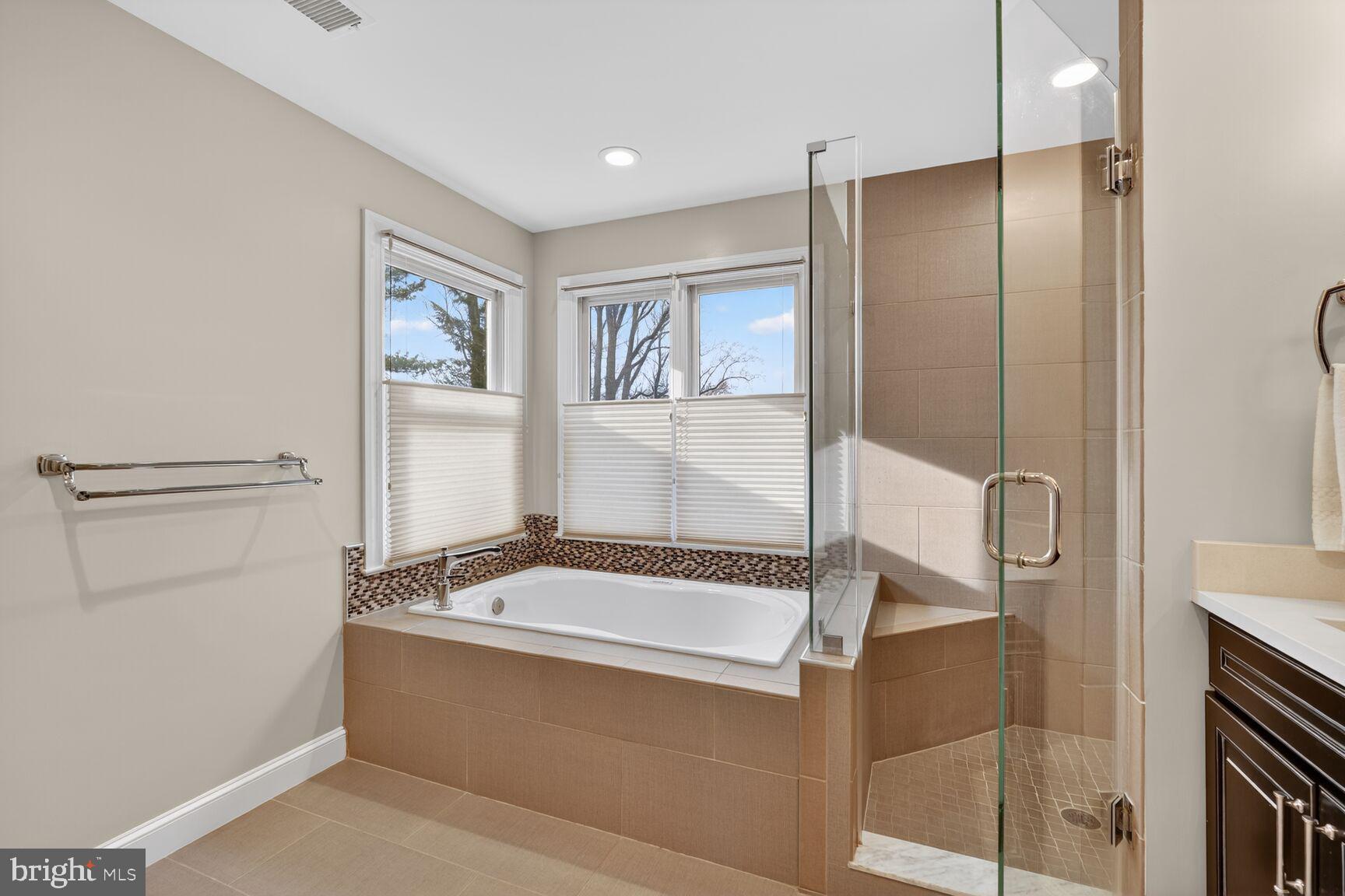 5206 Little Falls Road Arlington, VA 22207 - Photo 29 of 49 a bathroom with a tub and shower