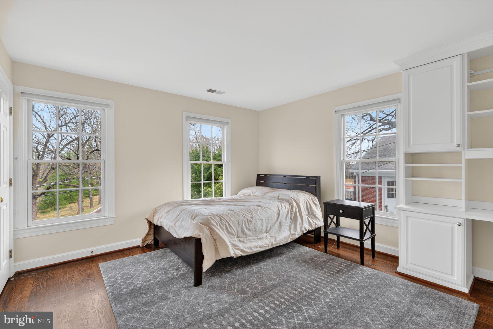 5206 Little Falls Road Arlington, VA 22207 - Photo 34 of 49 a bed sitting in a bedroom next to a window