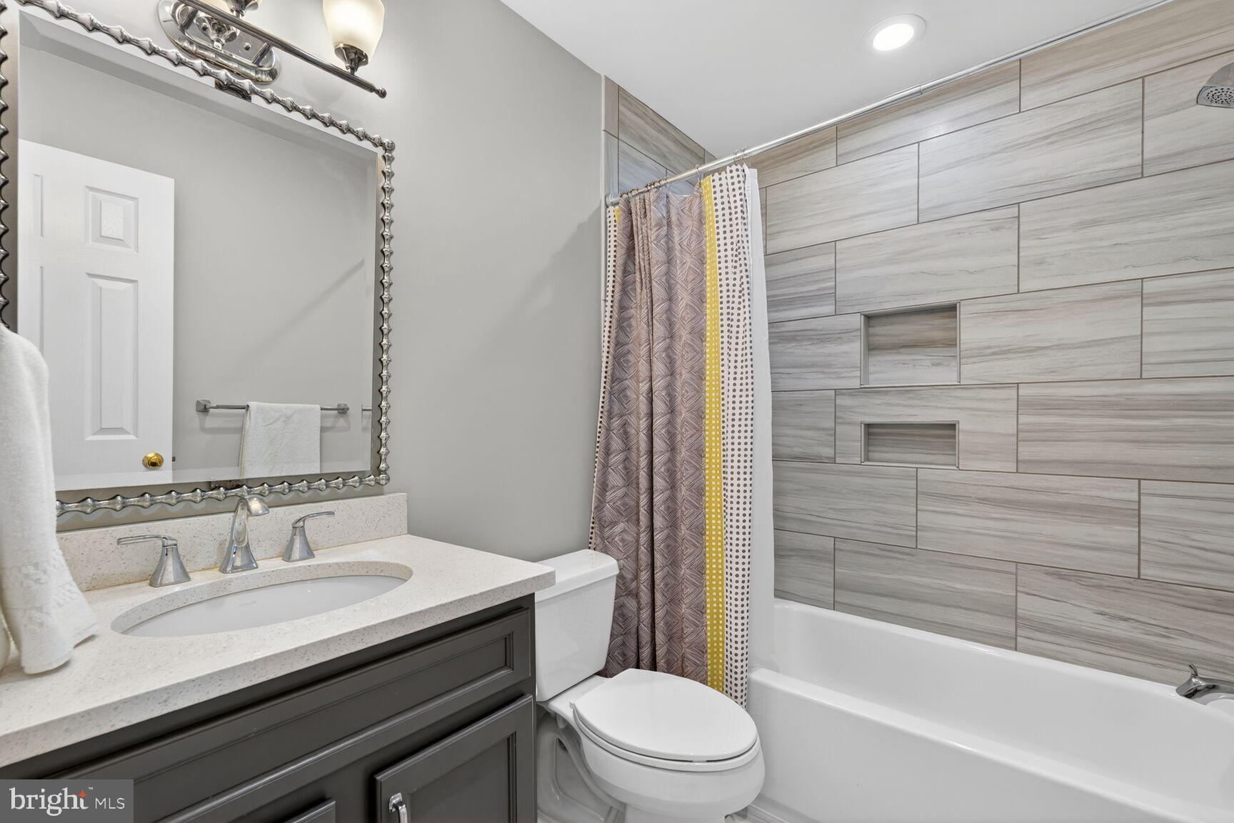 5206 Little Falls Road Arlington, VA 22207 - Photo 36 of 49 a bathroom with a sink a toilet and shower