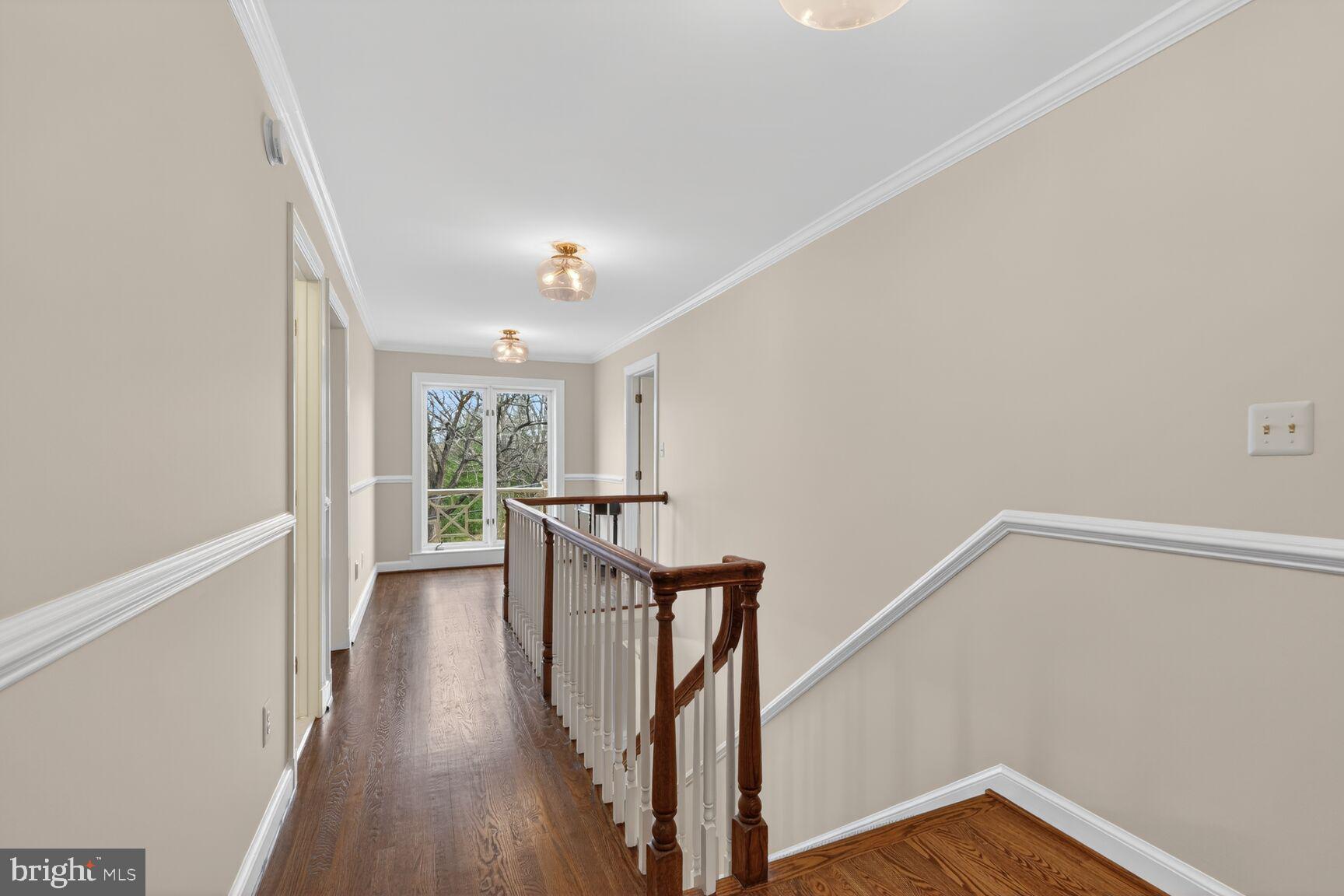 5206 Little Falls Road Arlington, VA 22207 - Photo 38 of 49 a view of a hallway with wooden floor and staircase