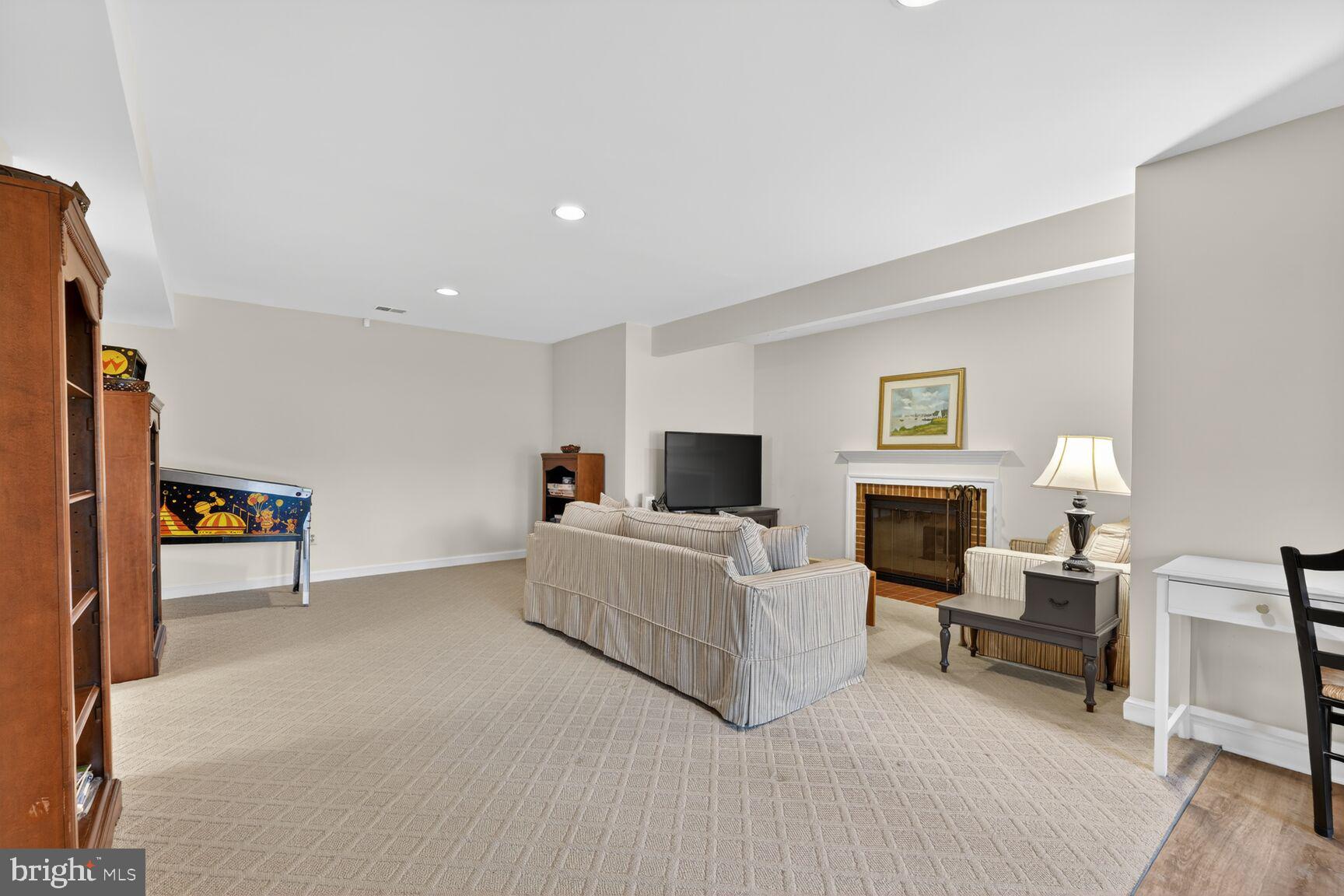 5206 Little Falls Road Arlington, VA 22207 - Photo 39 of 49 a living room with furniture and a fireplace