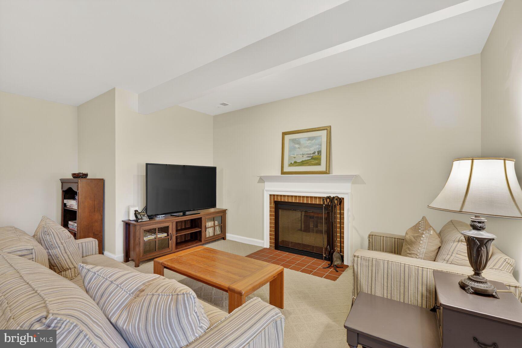 5206 Little Falls Road Arlington, VA 22207 - Photo 40 of 49 a living room with furniture and a flat screen tv
