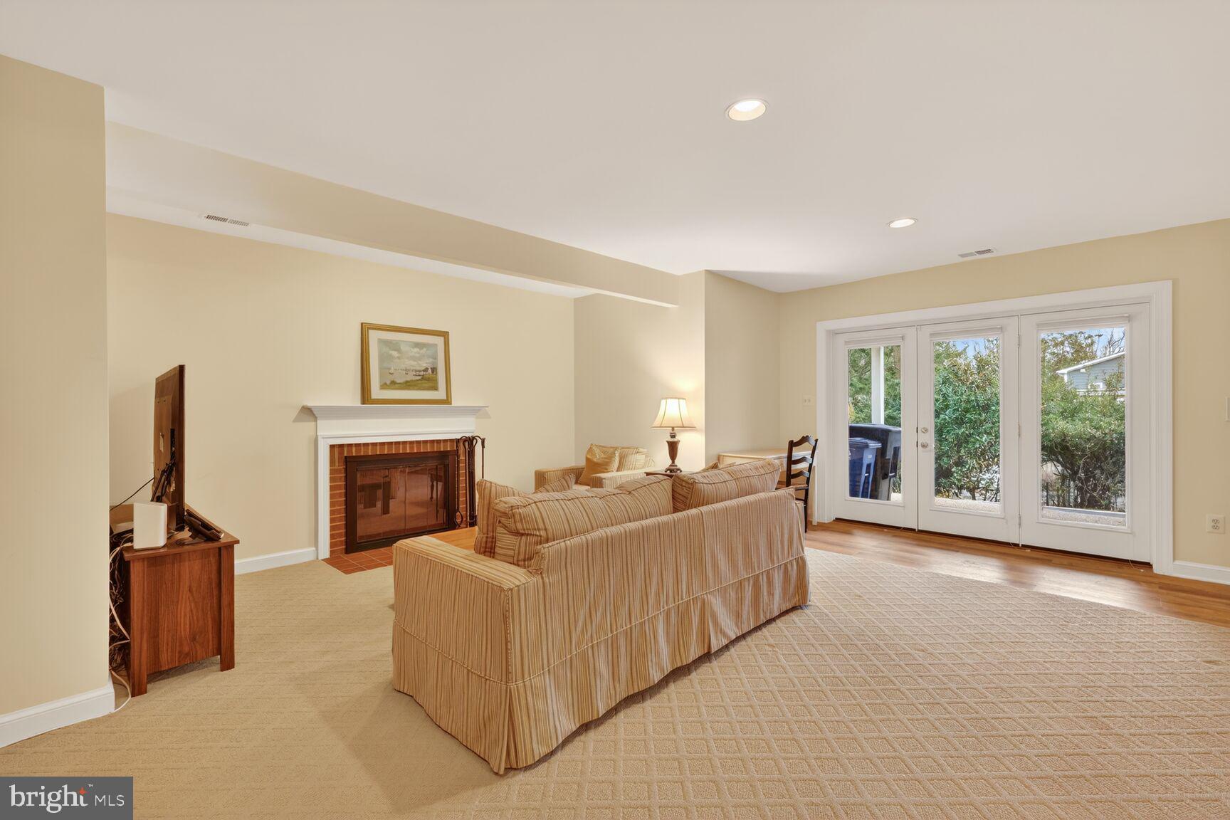 5206 Little Falls Road Arlington, VA 22207 - Photo 41 of 49 a living room with furniture and a fireplace