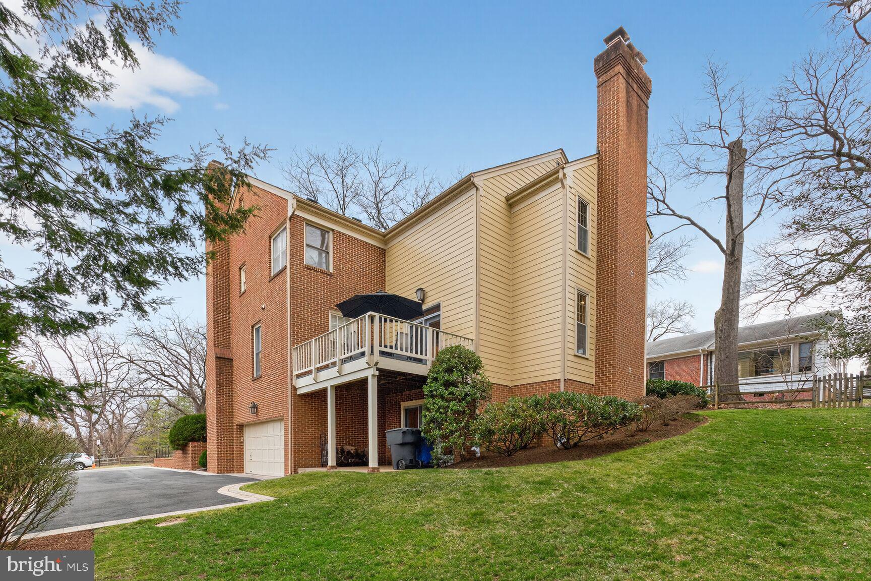 5206 Little Falls Road Arlington, VA 22207 - Photo 46 of 49 a view of a house with a yard and plants