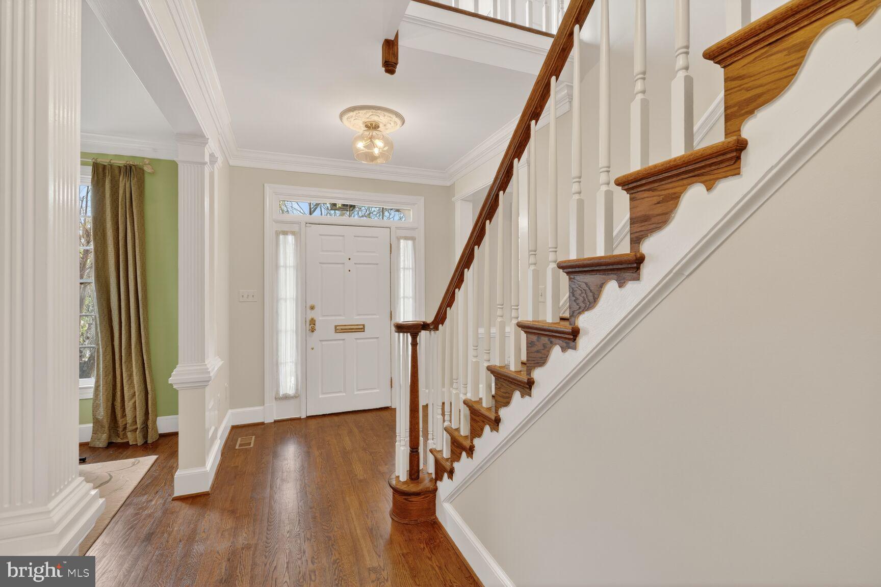 5206 Little Falls Road Arlington, VA 22207 - Photo 6 of 49 a view of entryway with wooden floor and stairs