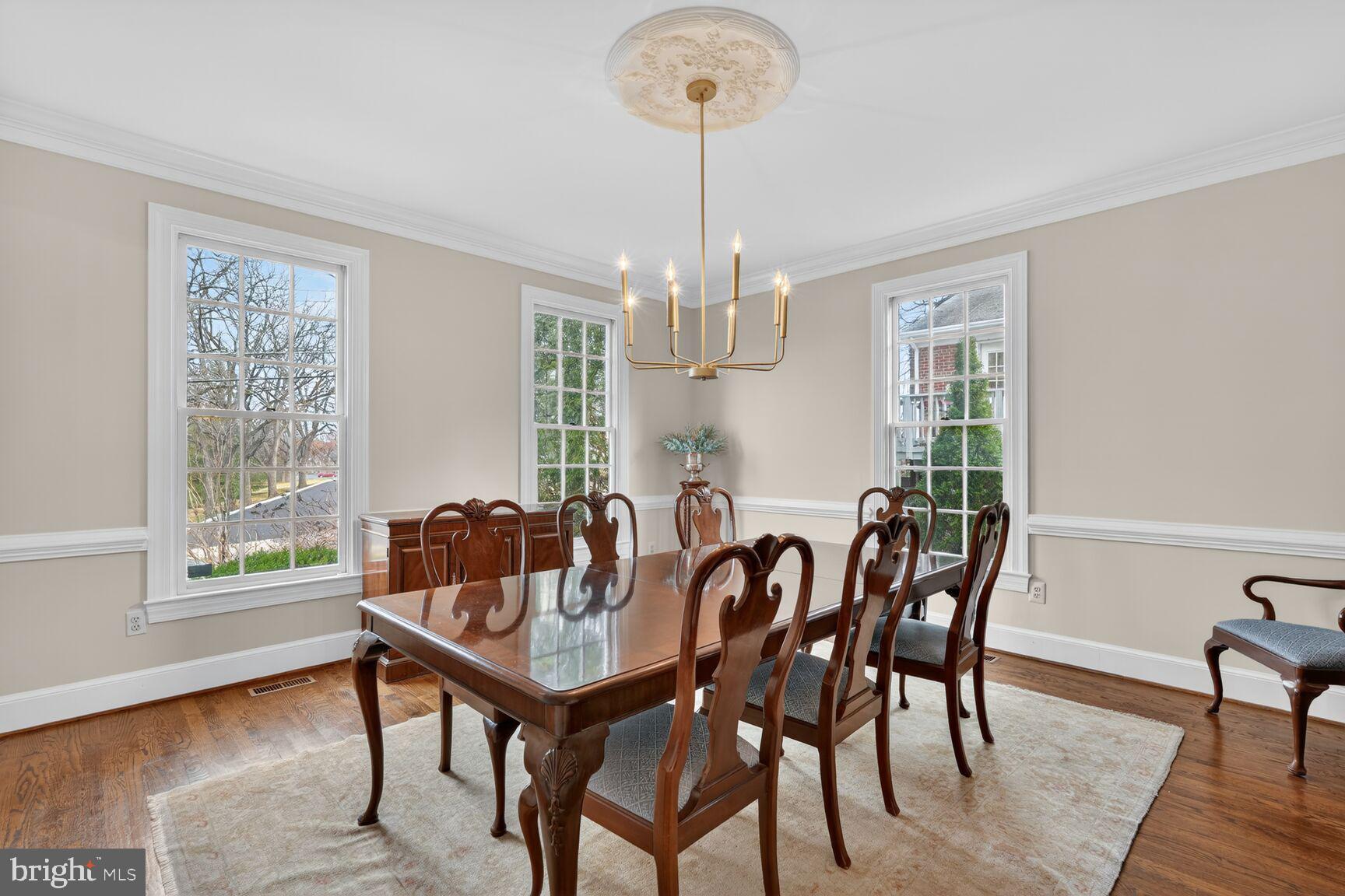 5206 Little Falls Road Arlington, VA 22207 - Photo 9 of 49 a view of a dining room with furniture window and wooden floor