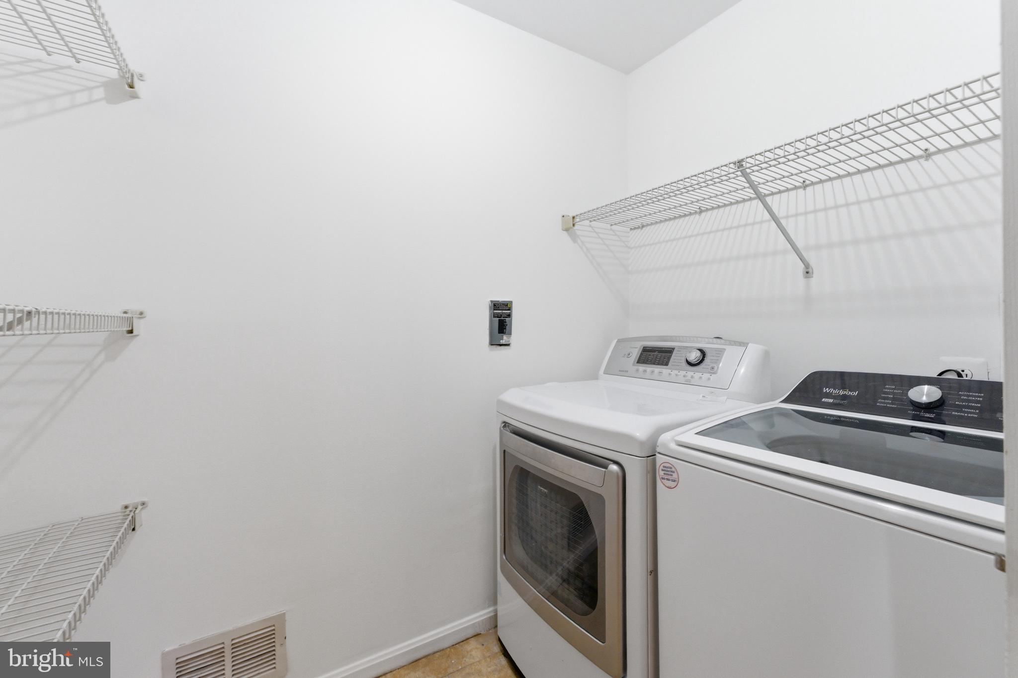 712 Brandon Green Drive Silver Spring, MD 20904 - Photo 14 of 41 Efficient laundry space with shelving.