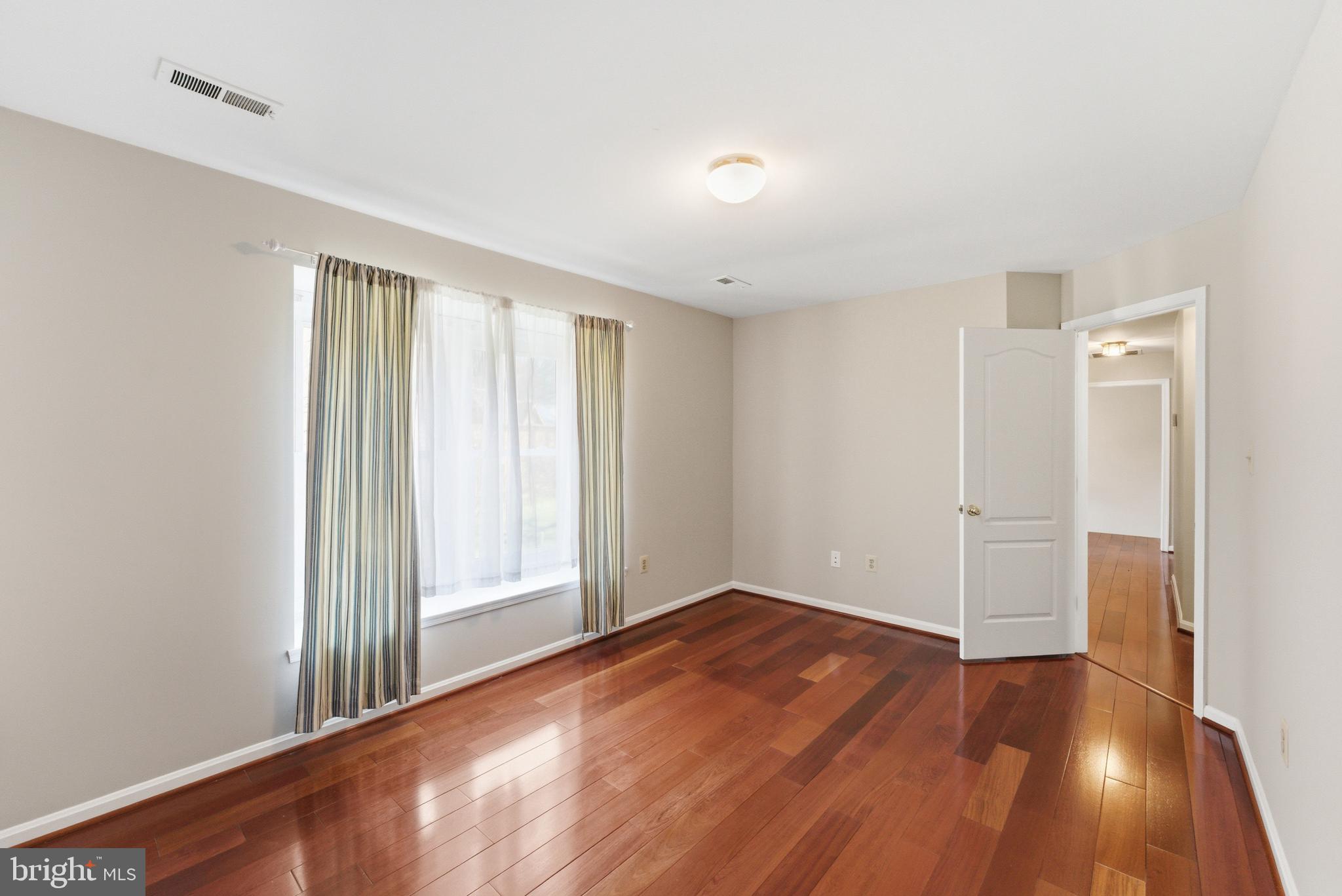 712 Brandon Green Drive Silver Spring, MD 20904 - Photo 29 of 41 Bright and airy room with hardwood floors.