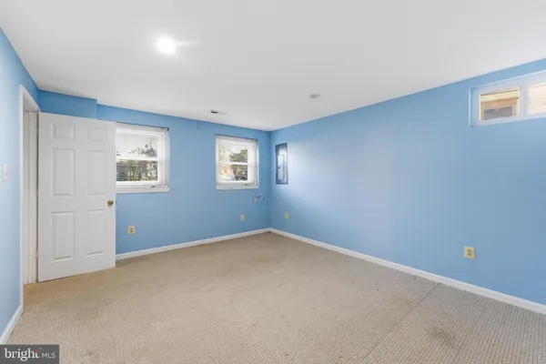 a view of an empty room with windows