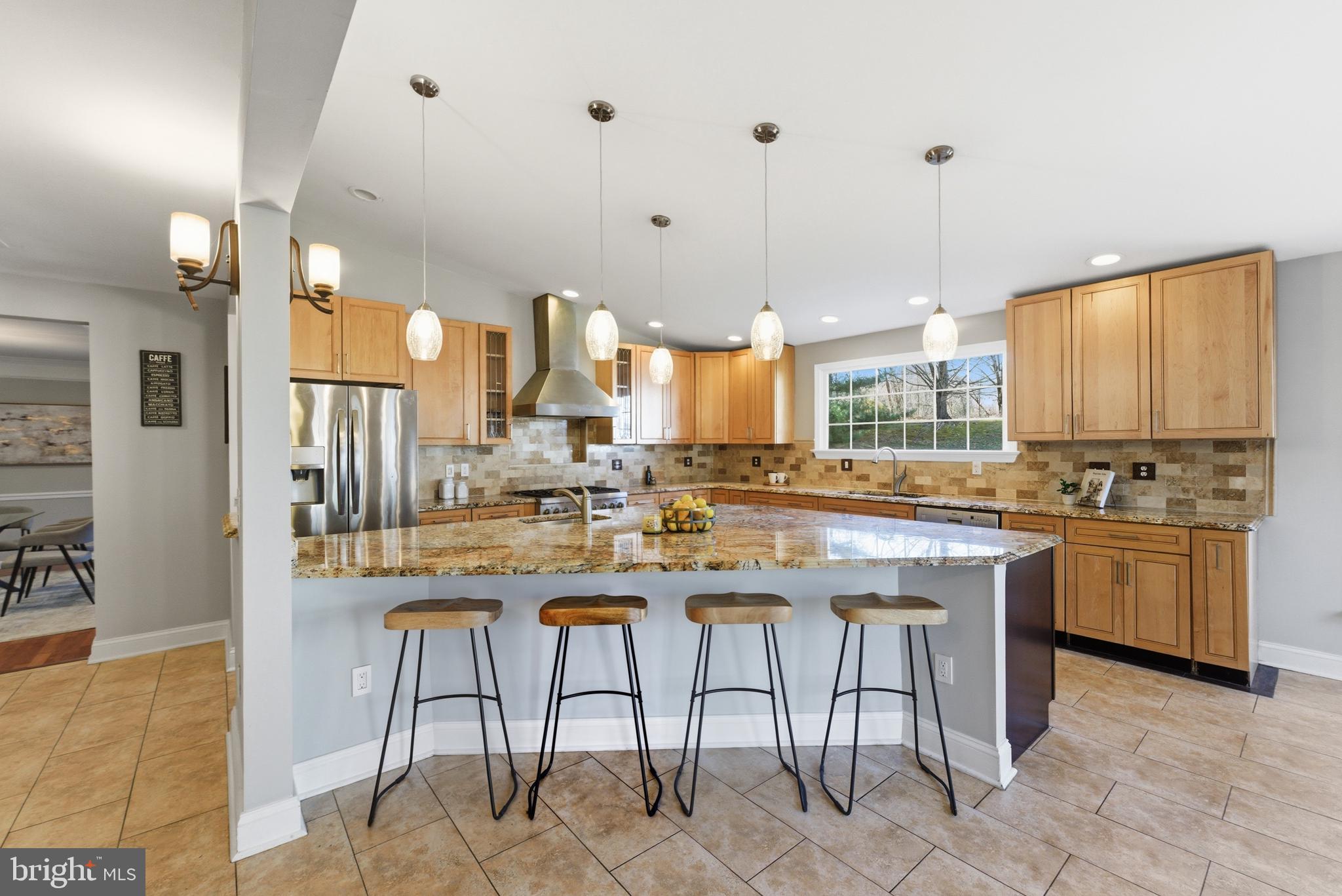 712 Brandon Green Drive Silver Spring, MD 20904 - Photo 10 of 41 Modern kitchen with warm wood accents.