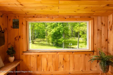 a view of a room with a window and sitting area