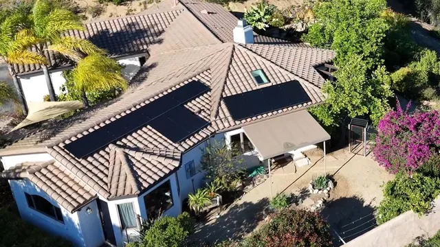 an aerial view of balcony and residential houses with outdoor space
