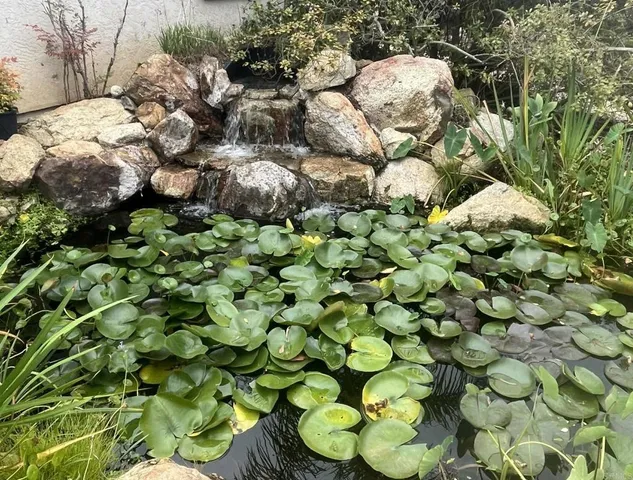 a house with a flower garden in front of it