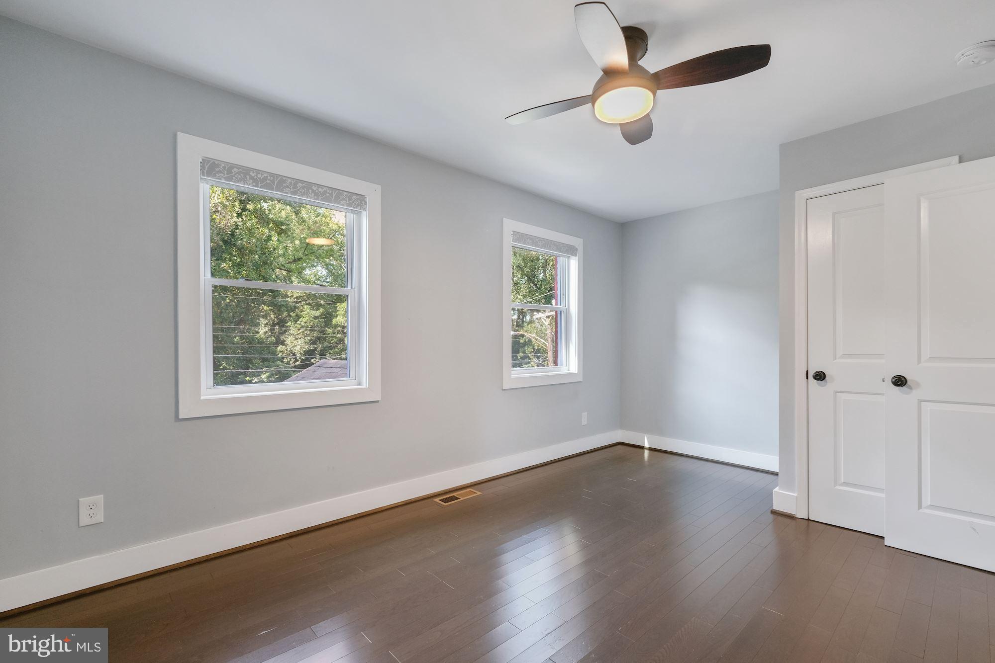 3158 M Place Southeast Washington, DC 20019 - Photo 11 of 22 a view of empty room with wooden floor and fan