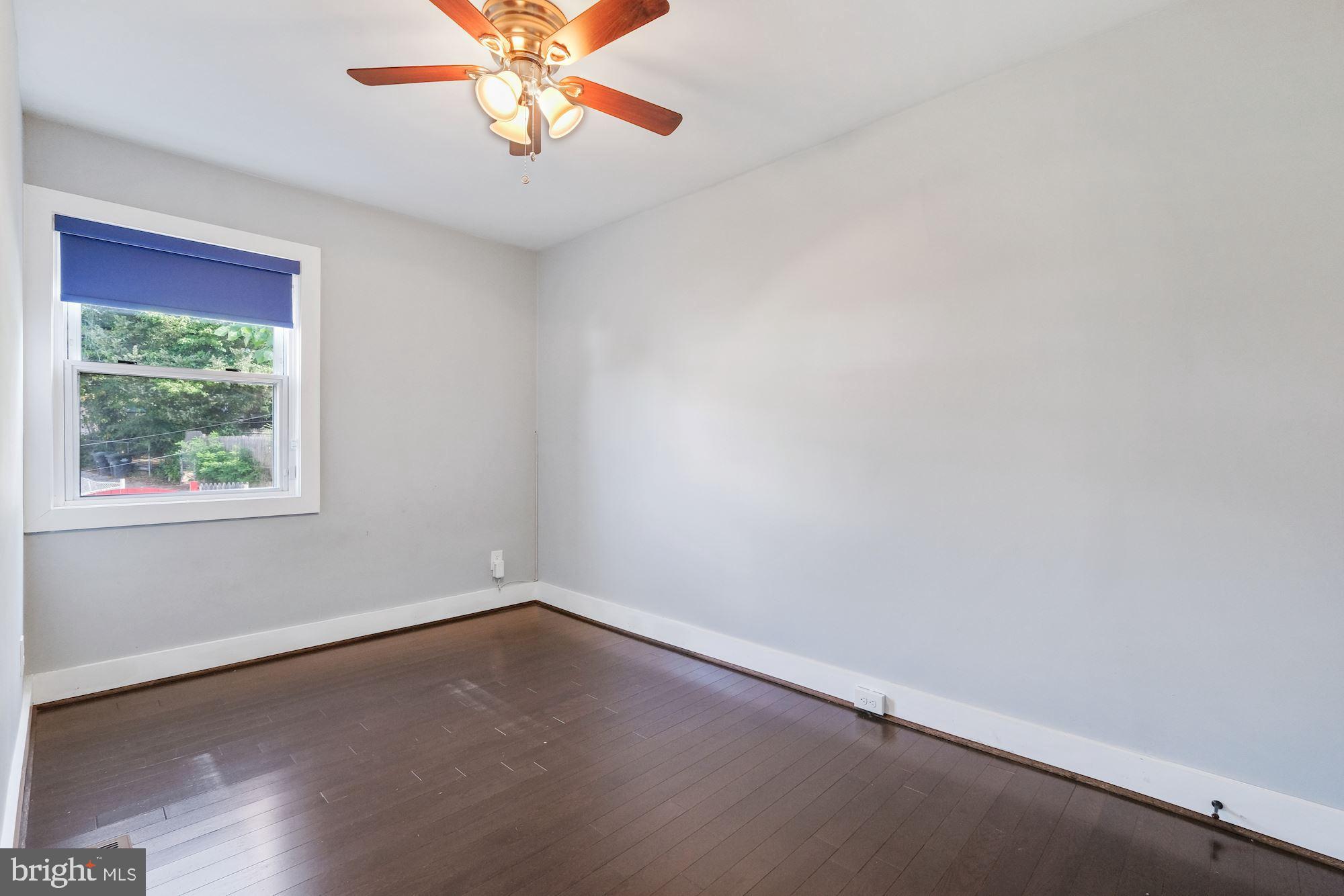 3158 M Place Southeast Washington, DC 20019 - Photo 13 of 22 an empty room with a window and a fan