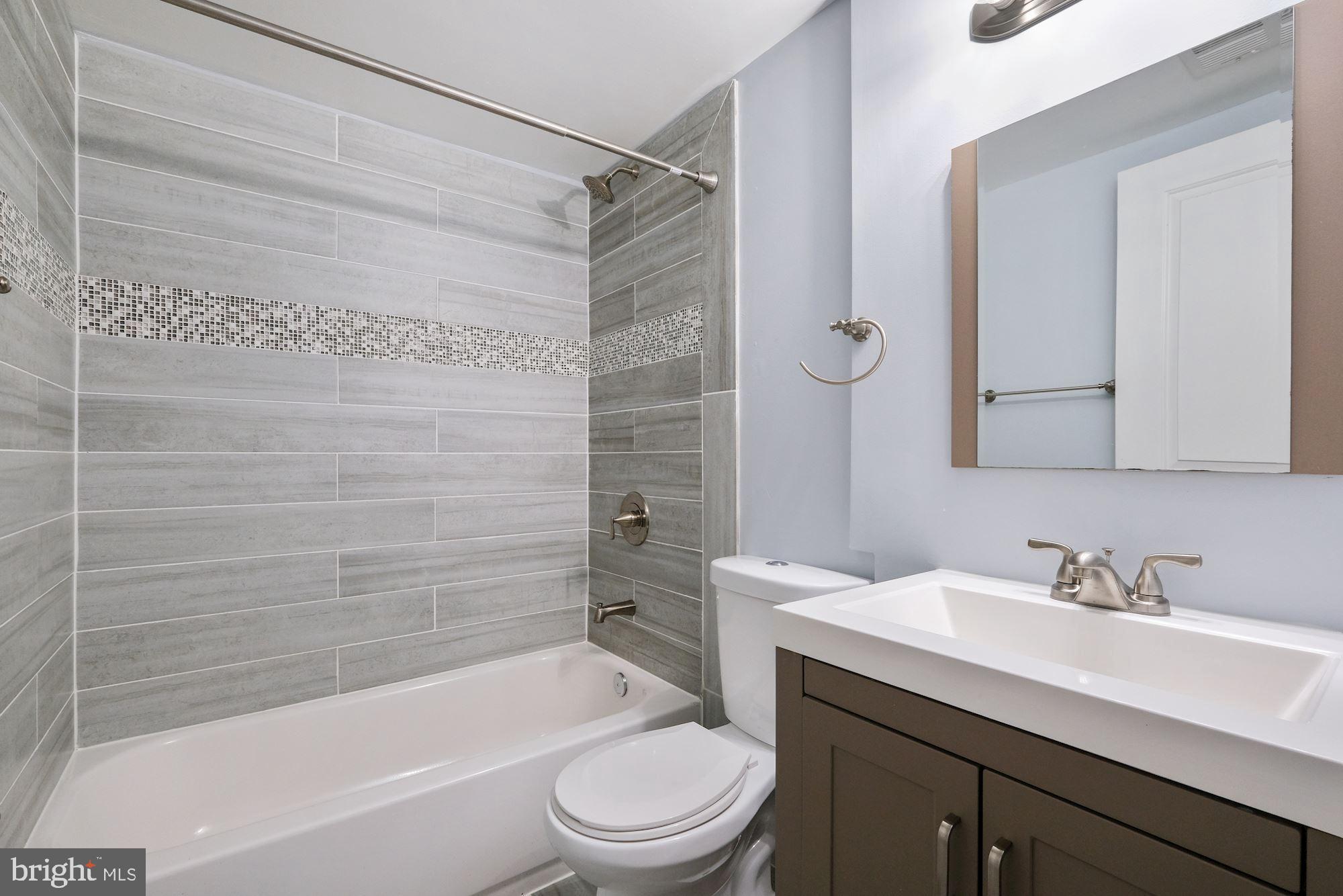 3158 M Place Southeast Washington, DC 20019 - Photo 17 of 22 a bathroom with a sink a toilet and shower