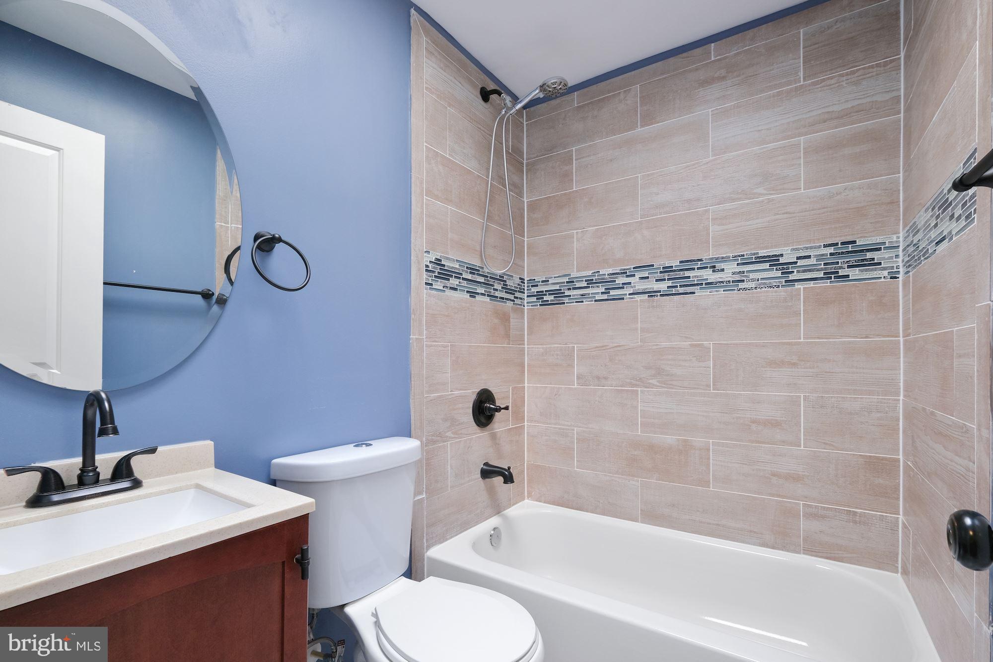 3158 M Place Southeast Washington, DC 20019 - Photo 18 of 22 a bathroom with a sink toilet and shower