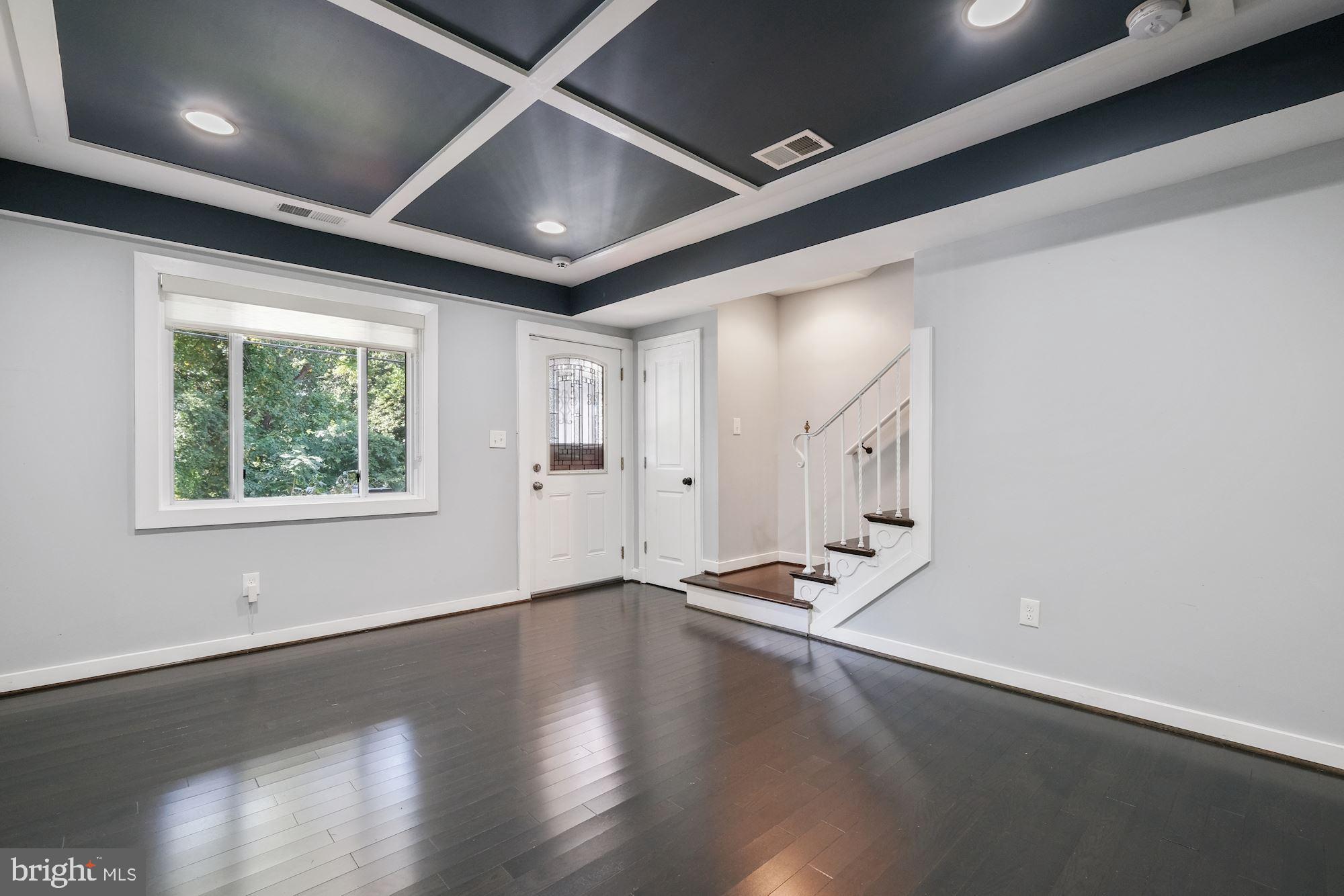 3158 M Place Southeast Washington, DC 20019 - Photo 6 of 22 a view of an empty room with wooden floor and a window