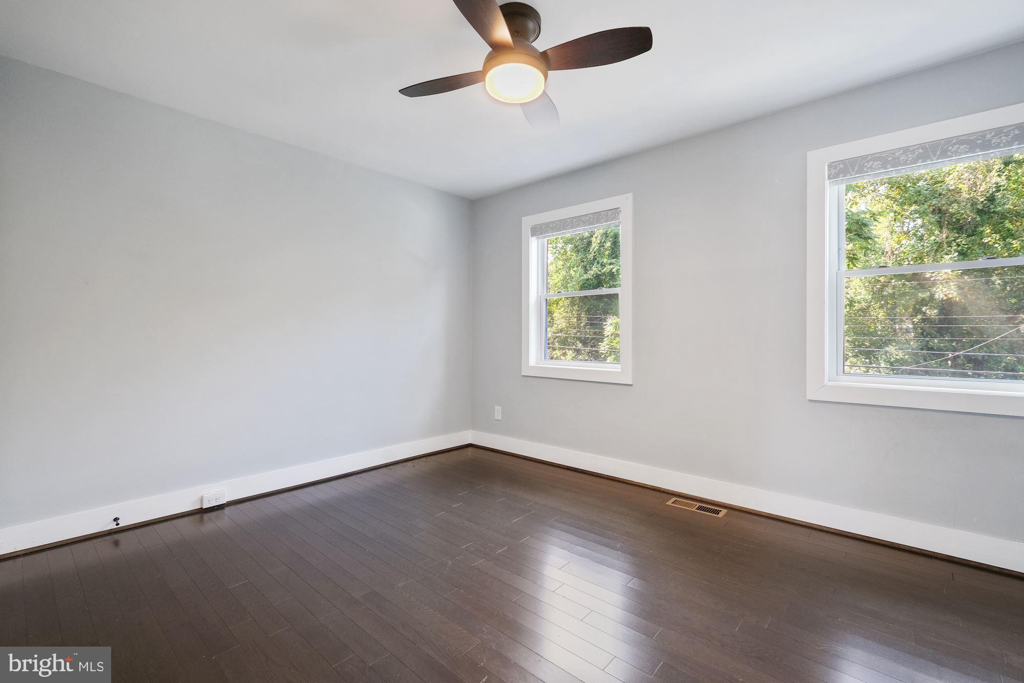 3158 M Place Southeast Washington, DC 20019 - Photo 10 of 22 a view of an empty room with wooden floor and a window