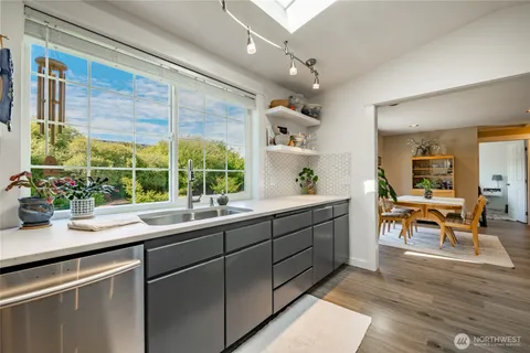 a kitchen with sink and window
