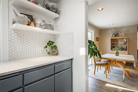a view of living room with furniture and potted plant