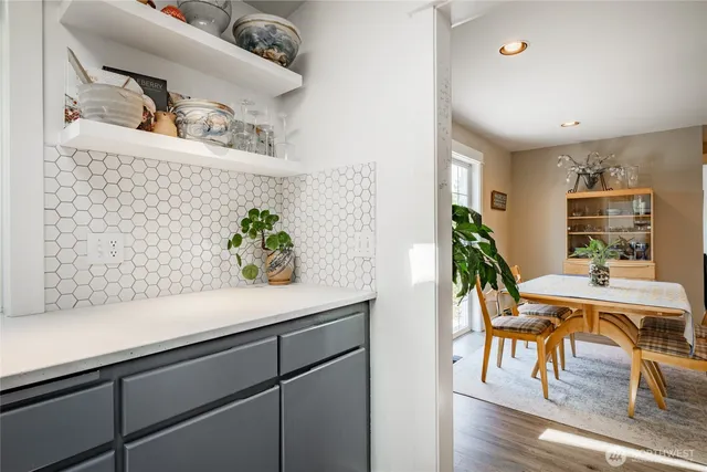 a view of living room with furniture and potted plant