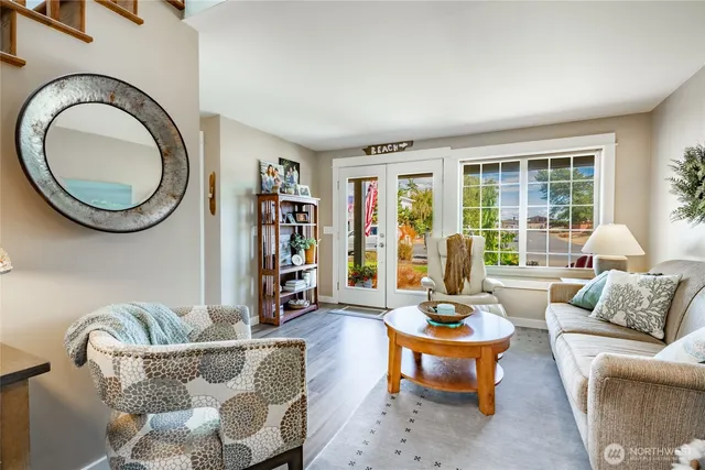a living room with furniture and a large window