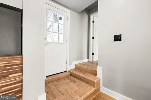 a view of bedroom with wooden floor