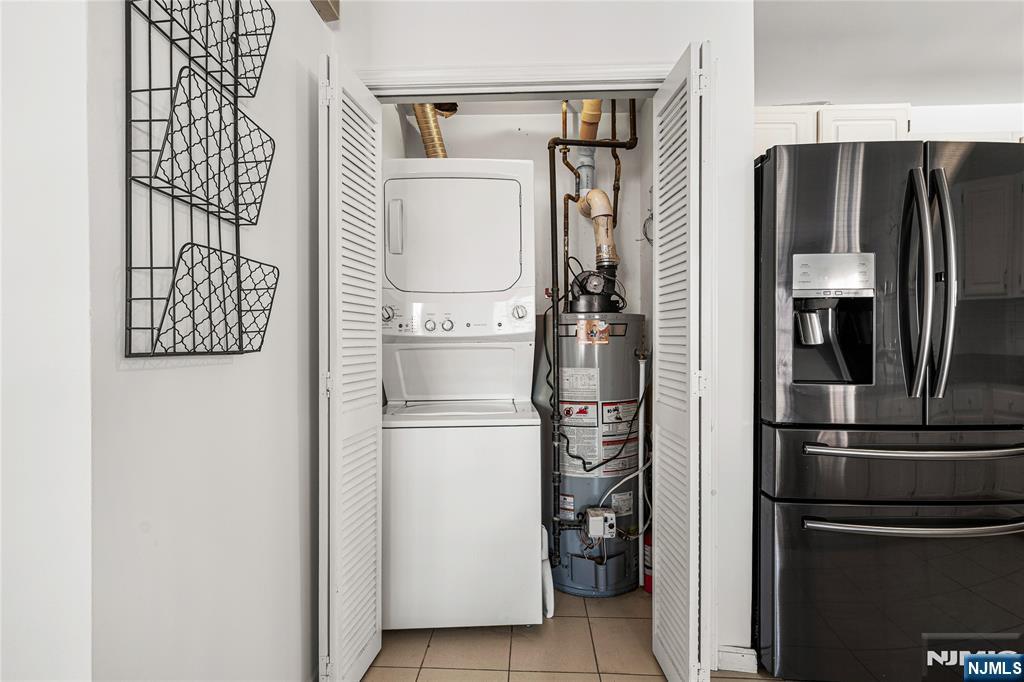 84 Union Street Newark, NJ 07105 - Photo 15 of 39 a white refrigerator freezer and a stove sitting inside of a kitchen