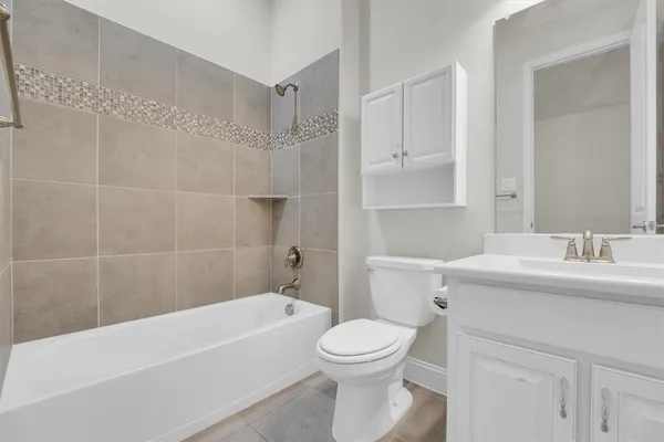 a bathroom with a sink toilet and a mirror