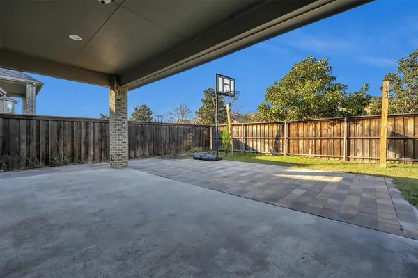 a view of a house with a yard and a slide