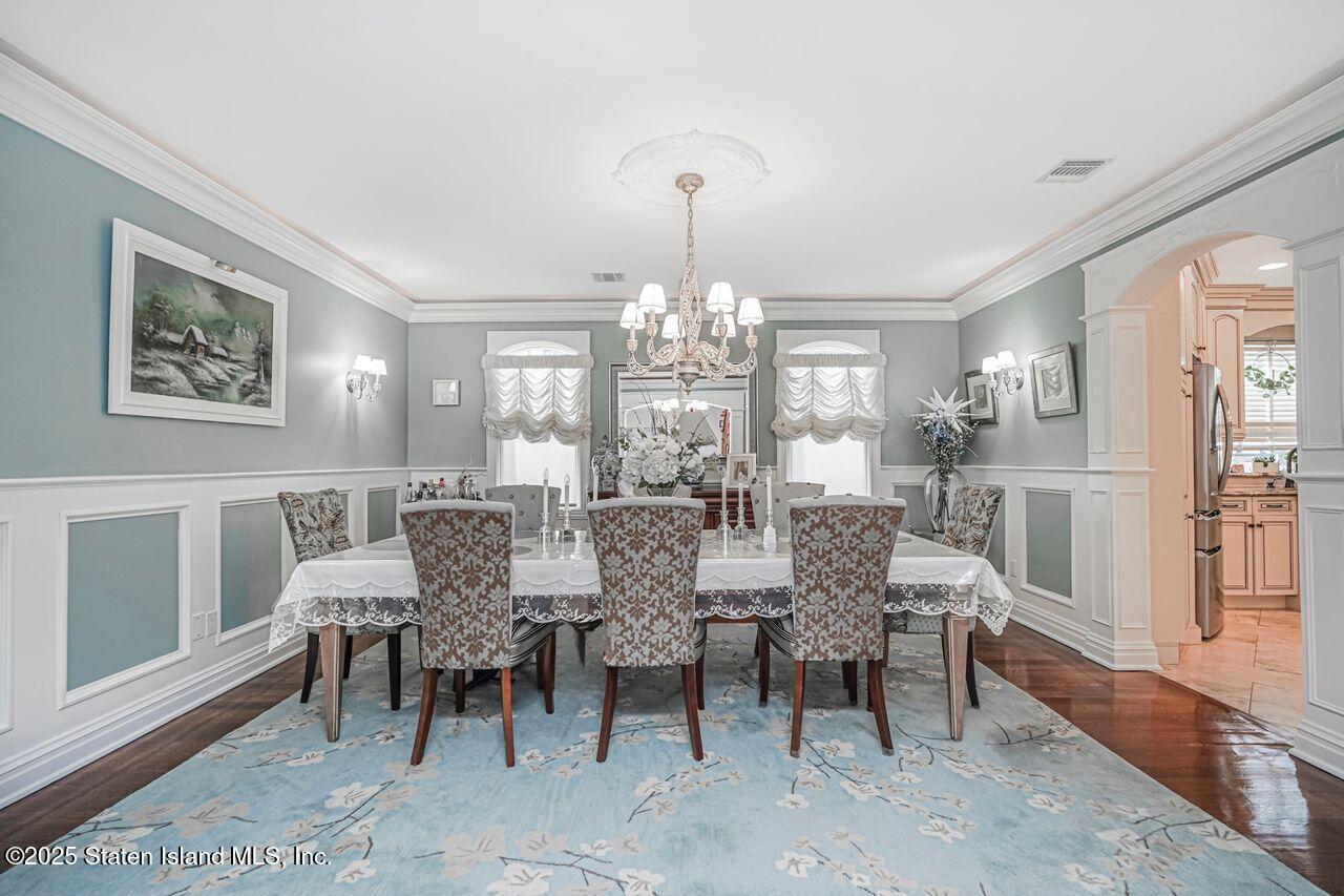 63 Finlay Avenue Staten Island, NY 10309 - Photo 11 of 45 a view of a dining room with furniture and chandelier