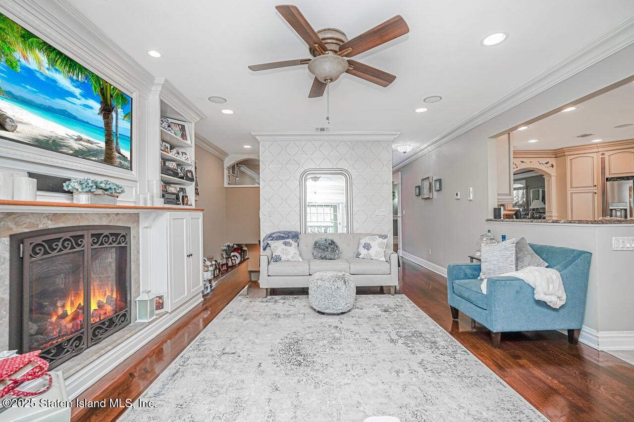 63 Finlay Avenue Staten Island, NY 10309 - Photo 23 of 45 a living room with furniture and a fireplace