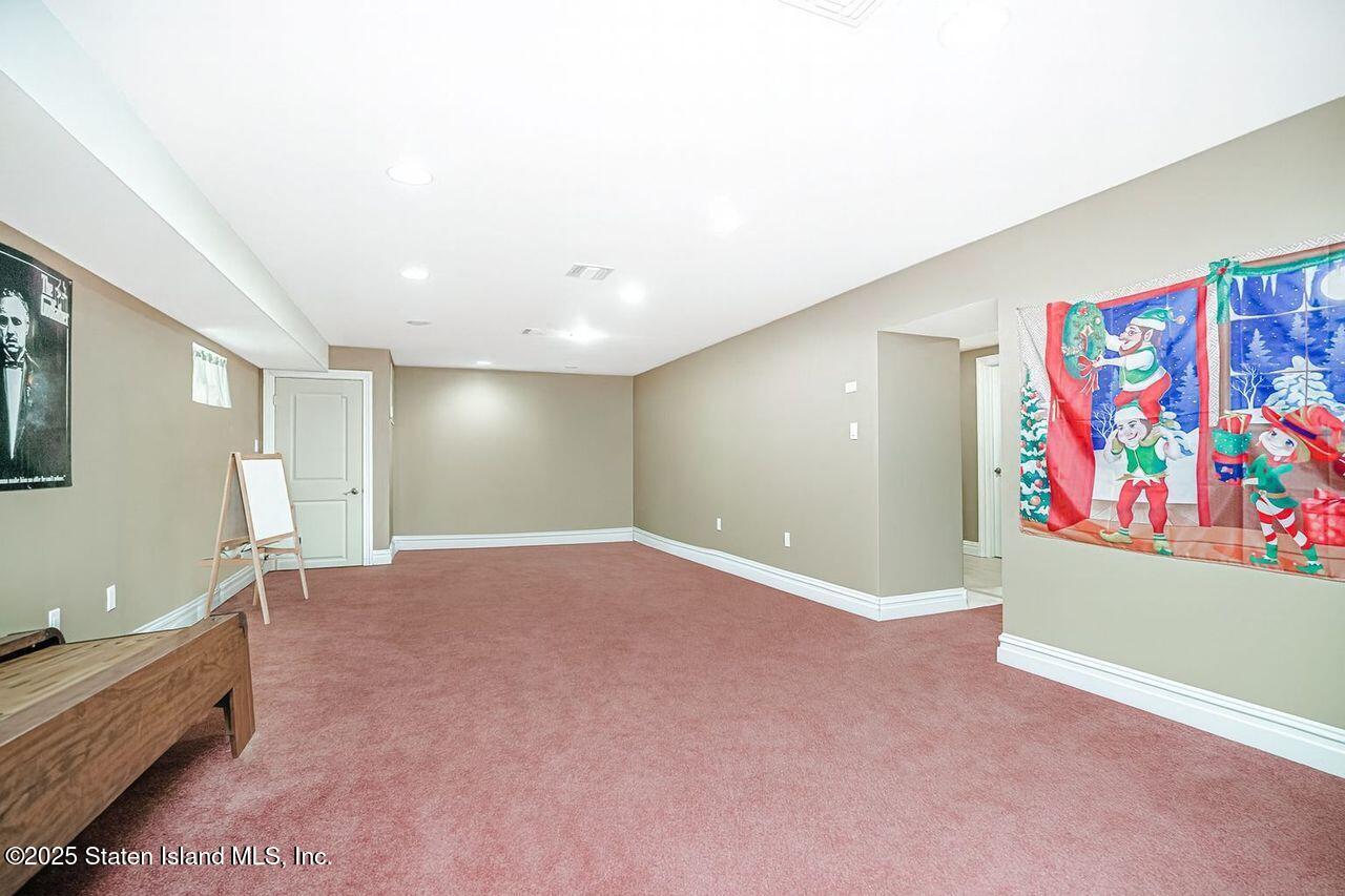 63 Finlay Avenue Staten Island, NY 10309 - Photo 40 of 45 a view of an empty room with window and cabinet