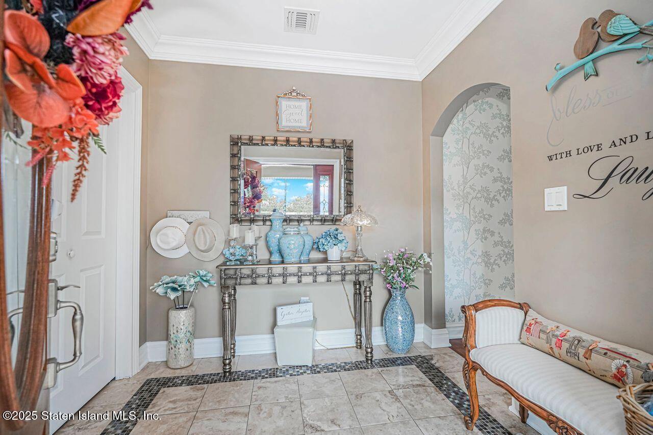 63 Finlay Avenue Staten Island, NY 10309 - Photo 5 of 45 a living room with furniture and a mirror