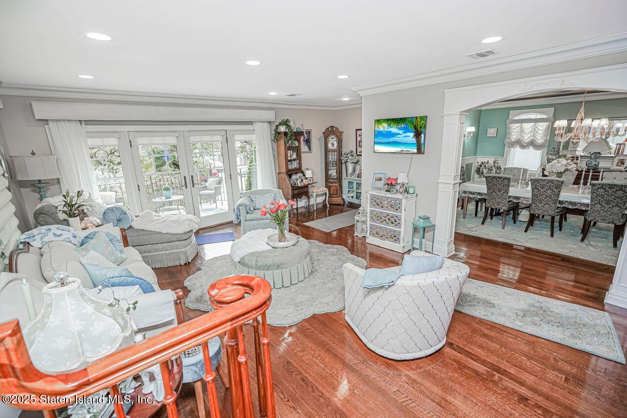 63 Finlay Avenue Staten Island, NY 10309 - Photo 8 of 45 a living room with furniture and a large window