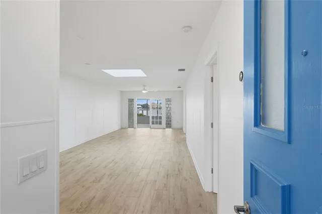 a view of hallway with wooden floor